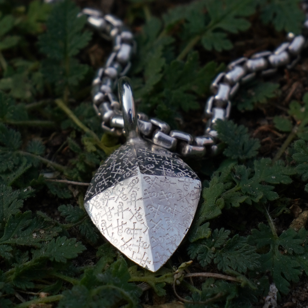 red diamond shield amulet
